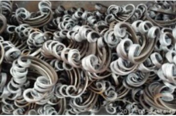 What is the composition of iron in wrought iron?